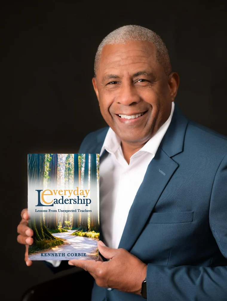 Kenneth Corbie holding his book, Everyday Leadership: Lessons From Unexpected Teachers